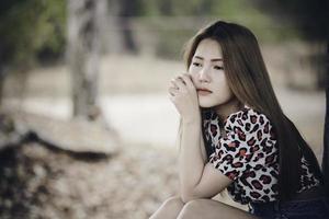 Beautiful thai woman very sad from unrequited love,rethink,think over,vintage style,dark tone,broken heart,asian girl photo