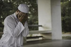 Asian islam man prayer,Young Muslim praying,Ramadan festival concept photo