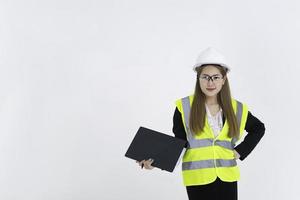 Beautiful asian Engineer woman Wear a suit, glasses and wearing a helmet on white background,Thailand people photo