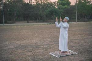 Asian islam man prayer,Young Muslim praying,Ramadan festival concept photo