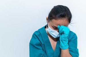 Asian doctor with Syringe and vaccine for protect covid-19 virus on white background photo