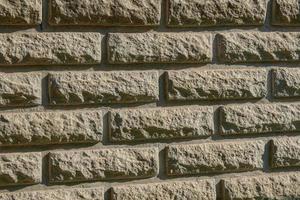 Texture of stone wall is similar to brickwork. photo