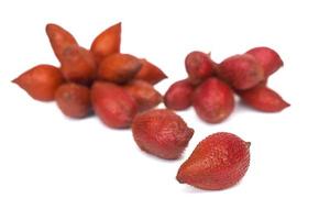 Salak or Zalacca is a species of palm tree native to Indonesia. It has a red rind and qa sour taste. photo