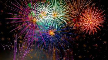 Colourful New Years Fireworks Display lighting up the night sky photo