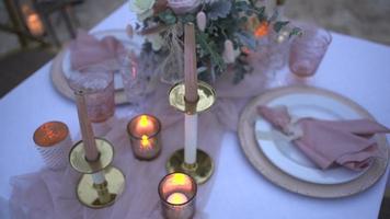 wedding decoration tablecloth flower glasses fire light romantic dinner.