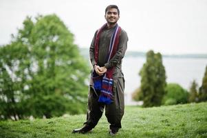 Indo pakistani man wear traditional clothes achkan or sherwani. photo
