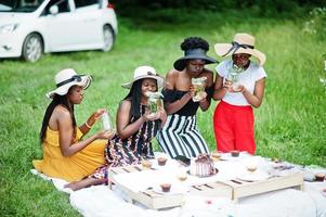 Group of african american girls celebrating birthday party outdoor with decor. photo