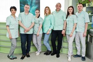 Medical theme. Portrait of the group of doctors at reception of diagnostic center in hospital. photo