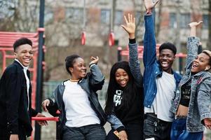 Young millennials african friends on outdoor gym. Happy black people having fun together. Generation Z friendship concept. photo