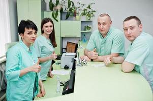 Medical theme. Group of doctors meeting at reception of diagnostic center in hospital. photo