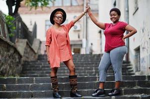 Two afircan woman friends having fun outdoor. photo