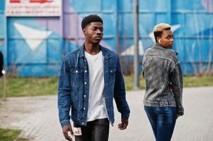 Young millennial african couple in city. Happy black friends in jeans jackets. Generation Z concept. photo