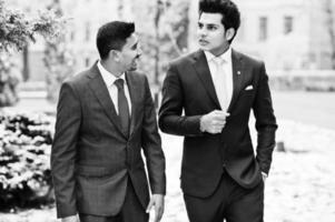 Two elegant indian fashionable mans model on suit posed at winter day. photo