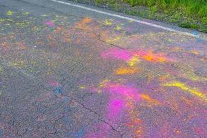 Colorful Holi powder scattered on a road photo
