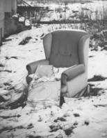 Old armchair in the snow photo