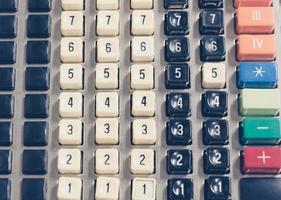 Keys on a vintage adding machine or till photo