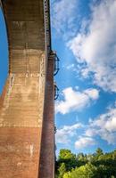 Tall rail or road viaduct viewed from underneath photo