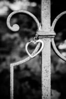 A heart pendant on a fence