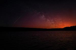 Starry sky over a lake photo