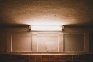 Florescent light between ceiling and wall photo