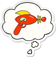 cartoon ray gun and thought bubble as a printed sticker vector