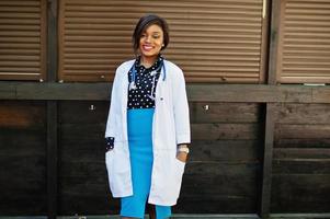 African american doctor female with stethoscope posed outdoor. photo