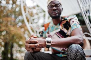 Close up royal watches on hand of rich african american man. photo