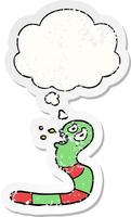 cartoon frightened worm and thought bubble as a distressed worn sticker vector