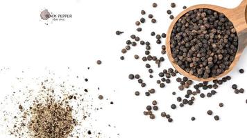 Black pepper seeds on white background. Food ingredients, spices photo
