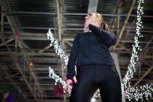 Figure skater woman at ice skating rink. photo