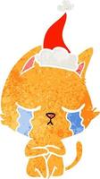 crying retro cartoon of a cat sitting wearing santa hat vector