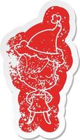 happy cartoon distressed sticker of a girl in cocktail dress wearing santa hat vector