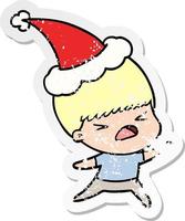 distressed sticker cartoon of a stressed man wearing santa hat vector