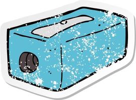 retro distressed sticker of a cartoon pencil sharpener vector