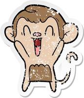 distressed sticker of a cartoon laughing monkey vector