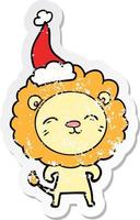distressed sticker cartoon of a lion wearing santa hat vector