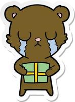 sticker of a crying cartoon bear with present vector