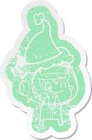 happy cartoon distressed sticker of a astronaut wearing santa hat vector