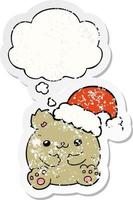 cute cartoon christmas bear and thought bubble as a distressed worn sticker vector
