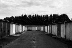 old garages in black and white photo