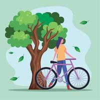 árbol y ciclista femenina vector