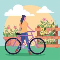 mujer con bicicleta en el jardín vector