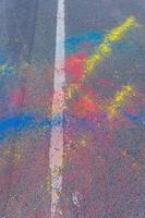 Colorful Holi powder scattered on a road photo