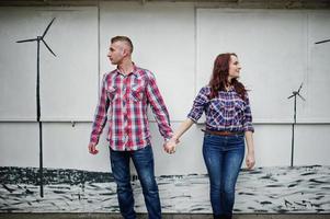 Stylish couple wear on checkered shirt in love together. photo