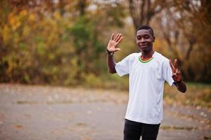 African man in white football sport t-shirt of Ghana Africa country. photo