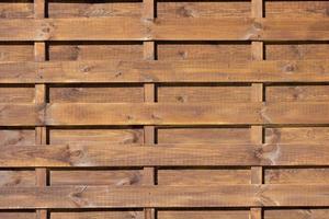 wooden fence as background in the sun photo