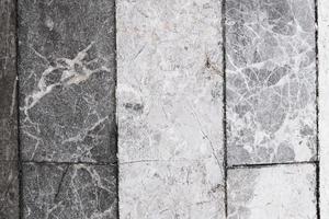 old weathered marble blocks, floor with stains and scratches, pattern and texture, colorful background, textured surface photo