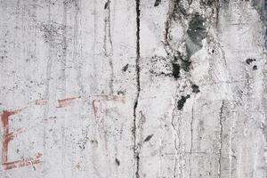 Old textured wall made of cement, dirty concrete surface, texture and pattern, grunge background, weathered building facade. photo