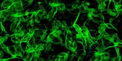 Abstract green smoke on black background photo