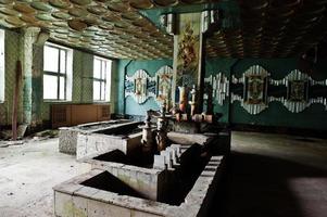 Industrial interior of an old porcelain abandoned factory. photo